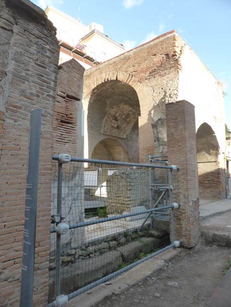 Herculaneum, September 2015.  Looking north-east towards four-sided arch at east front side of Augusteum.